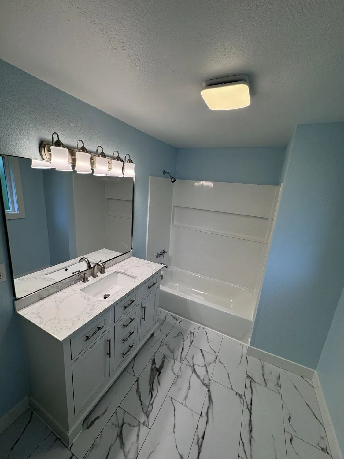 Custom vanity with floral feature wall